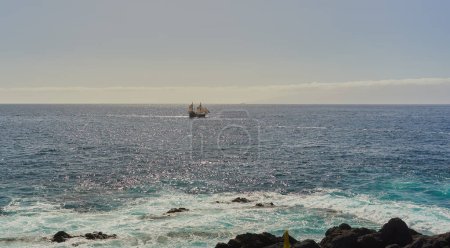 Old ship with sails in the Atlantic ocean, off the shore of Tenerife