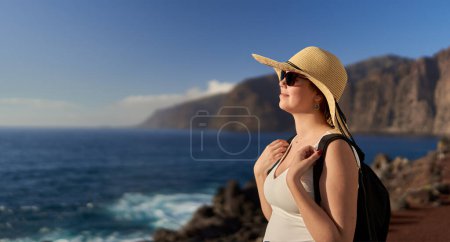 Photo for Beautiful young happy woman in vacation on shore of Tenerife, at Atlantic Ocean - Royalty Free Image