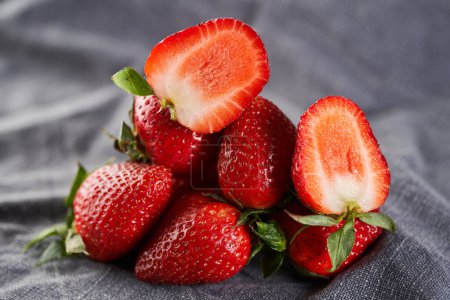 Photo for Fresh strawberries in closeup, studio shot on gray cloth - Royalty Free Image