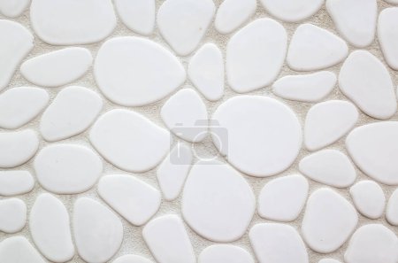 Photo for Wall of oval and round stone on white background - Royalty Free Image