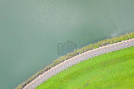 Photo for Abstract landscape of road with grassland near the lake - Royalty Free Image