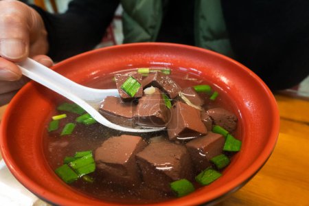 Bowl of Taiwanese pig's blood soup on the table
