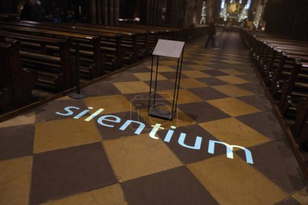 Photo for An image of the word silentium projected on the floor of a church - Royalty Free Image