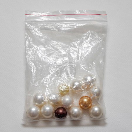 Photo for Artificial Faux Pearls Jewellery Making Material in Plastic Bag - Royalty Free Image