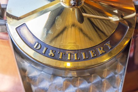 Téléchargez les photos : Engraved Brass Metal Sign Distillery at Production Equipment - en image libre de droit