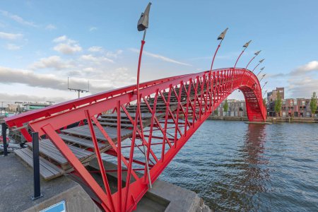 Photo for Red Python Bridge at Eastern Docklands in Amsterdam Netherlands Evening - Royalty Free Image