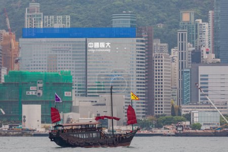 Photo for Hong Kong, China - April 23, 2017: White Sign China Evergrande at Office Building VIew From Victoria Harbour in Hong Kong City. - Royalty Free Image