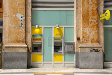 Photo for Naples, Italy - June 22, 2014: Two Postamat ATM in Window Italian Post Office at Galleria Umberto I Shopping Arcade in City Centre. - Royalty Free Image