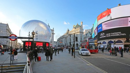 Photo for London, United Kingdom - November 19, 2013: Piccadilly Circus Snow Globe Christmas and Underground Station in Capital City Winter Day. - Royalty Free Image