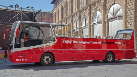 Photo for Bologna, Italy - June 16, 2019: Open Top Red Bus Original Tour of City at Sunny Summer Day. - Royalty Free Image