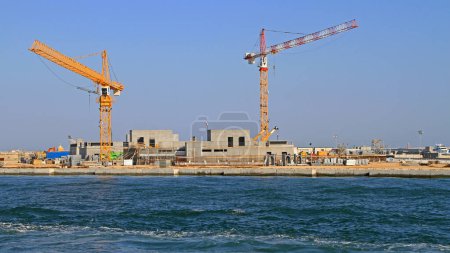 Photo for Venice, Italy - July 08, 2011: Two Cranes at Construction Site Building Seawall MOSE Project for Flood Protection Venetian Lagoon. - Royalty Free Image