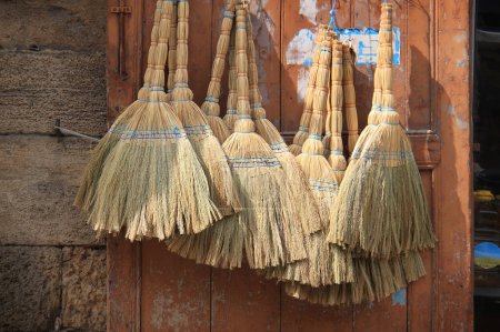 A background of traditional straw brooms in the Lebanese town of Batroun.
