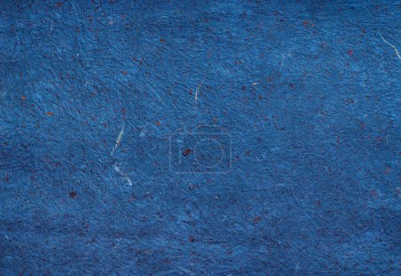 Photo for Wrinkled Deep Blue paper with embedded copper colored flecks and white scratches - Royalty Free Image