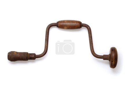 Photo for An old, worn and rusted hand drill with wooden handles. Isolated on white with drop shadow. - Royalty Free Image