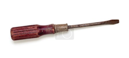 Photo for An old, rusted and pitted flat head screwdriver with a worn wooden handle. Viewed from above, isolated on white with drop shadow - Royalty Free Image
