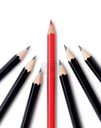 Photo for A shiny red pencil leads the pack showing the way just ahead of several shiny black pencils. Isolated on white with drop shadows. - Royalty Free Image