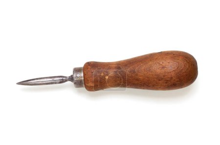 Photo for An old, tarnished wooden handled awl. Viewed from above, isolated on white with drop shadow - Royalty Free Image