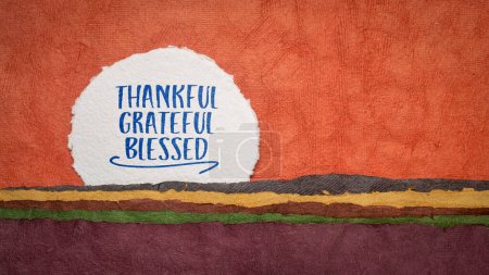 Photo for Thankful, grateful, blessed inspirational words, Thanksgiving holiday concept - handwriting on an abstract paper landscape - Royalty Free Image
