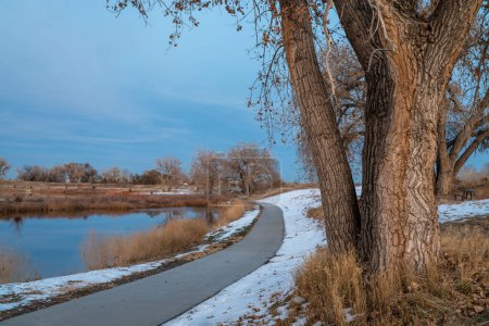 Photo for November dusk over a bike trail - South Platte River Trail near Brighton in northern Colorado - Royalty Free Image