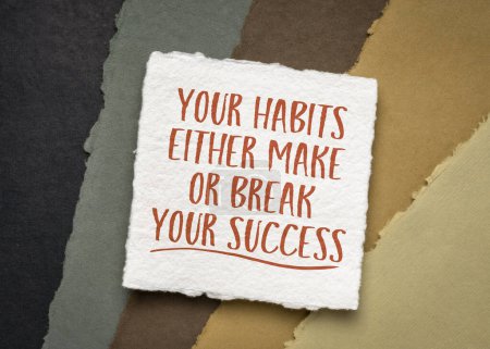 Photo for Your habits either make or break your success - inspirational note on white handmade paper against paper abstract in earth tones, personal development and growth concept - Royalty Free Image
