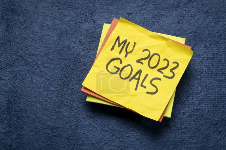 My 2023 goals  - handwriting in black ink on a reminder note, New Year goals and resolutions concept