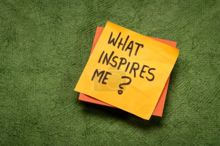 Photo for What inspires me? Handwritten question on a sticky note. Inspiration and personal development concept. - Royalty Free Image