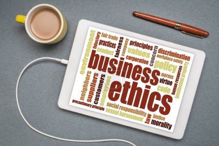 Téléchargez les photos : Business ethics word cloud sur une tablette numérique avec une tasse de café - en image libre de droit