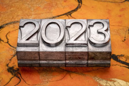 Photo for 2023 year in grunge metal type against colorful marbled paper, New Year concept - Royalty Free Image