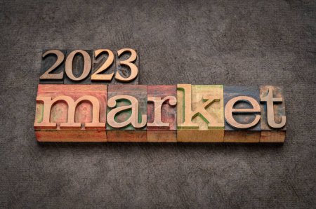 Photo for 2023 market prediction banner in vintage letterpress wood type against grunge handmade paper, finance, economy and recession concept - Royalty Free Image