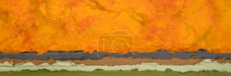 Foto de Fantasy paper landscape created with marbled lokta paper and sheets of handmade rag paper, panoramic web banner - Imagen libre de derechos