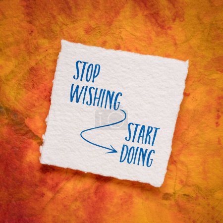 Foto de Stop wishing, start doing - motivation note, reminder or advice, handwriting on an art paper, business or personal development concept - Imagen libre de derechos