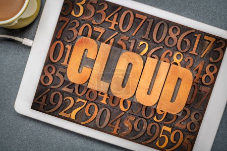 Foto de Cloud computing concept - word in vintage letterpress wood type against numbers on a digital tablet - Imagen libre de derechos