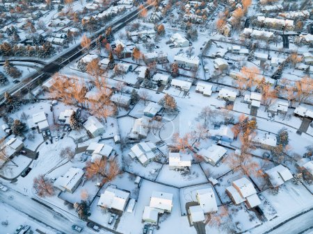 Foto de Winter sunrise over residential area of Fort Collins covered by snow in northern Colorado, aerial view - Imagen libre de derechos