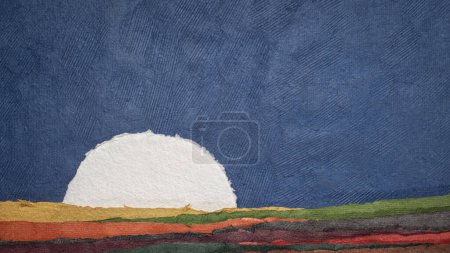 Foto de Moon or sun rising over abstract colorful paper landscape - Imagen libre de derechos