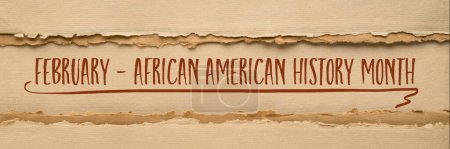 Téléchargez les photos : February - Black History Month banner, e handwriting on an art paper, annual observance originating in the United States - en image libre de droit