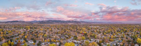 Téléchargez les photos : October dawn over Fort Collins and foothills of Rocky Mountains in northern Colorado, aerial panorama banner - en image libre de droit