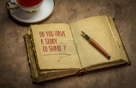 Foto de Do you have a story to share? Handwriting in a retro journal with a cup of tea, storytelling concept. - Imagen libre de derechos