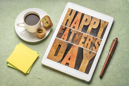 Photo for Happy father's day - a word abstract in vintage letterpress wood type on a digital tablet with a cup of coffee, greeting card - Royalty Free Image