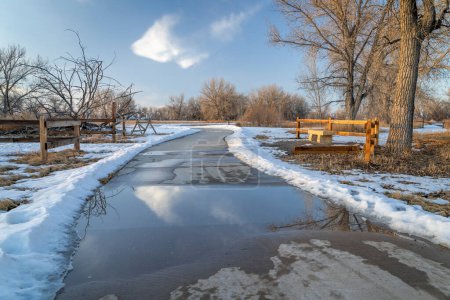 Photo for Paved bike trail in winter scenery - Poudre River Trail near Greeley in Colorado - Royalty Free Image