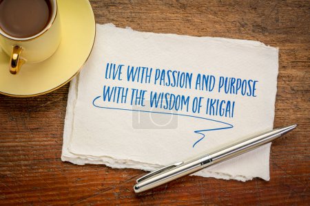 Foto de Live with passion and purpose with the wisdom of ikigai. Inspirational writing on a  handmade paper, lifestyle and career concept. - Imagen libre de derechos