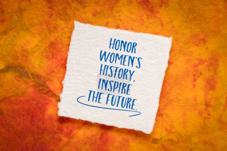 Foto de Honor women's history, inspire the future, inspirational handwriting on art paper. - Imagen libre de derechos
