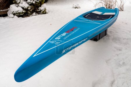 Photo for Fort Collins, CO, USA - March 25, 2023: A fast touring stand up paddleboard designed for flatwater (2023 Waterline model by Starboard), preparing for a paddling and racing season. - Royalty Free Image