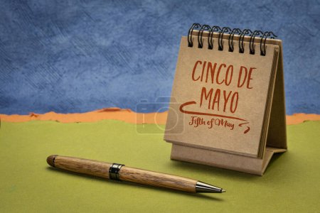Photo for Cinco de Mayo, Fifth of May, more popular in the United States than Mexico, this holiday has become associated with the celebration of Mexican-American culture, note in a desktop calendar - Royalty Free Image