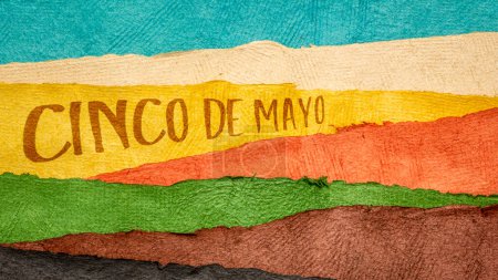 Photo for Cinco de Mayo, Fifth of May, more popular in the United States than Mexico, this holiday has become associated with the celebration of Mexican-American culture, note against abstract paper landscape - Royalty Free Image