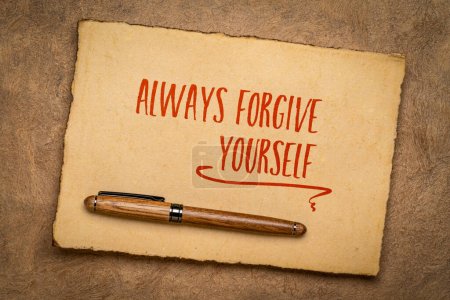 Photo for Always forgive yourself inspirational advice or reminder - handwriting on a handmade paper, positive mindset and personal development concept - Royalty Free Image