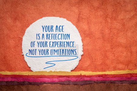 Photo for Your age is a reflection of your experience, not your limitations. Inspirational handwriting on an art paper, healthy aging and personal development concept. - Royalty Free Image