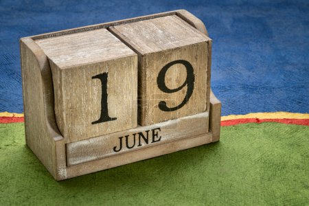 Photo for Juneteenth (June 19) in a desktop wooden calendar  also known as Freedom, Jubilee, Liberation and Emancipation Day  is a holiday celebrating the emancipation of those who had been enslaved in US. - Royalty Free Image