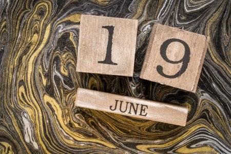 Photo for Juneteenth (June 19) in a desktop wooden calendar  also known as Freedom, Jubilee, Liberation, and Emancipation Day  holiday celebrating the emancipation of those who had been enslaved in the US. - Royalty Free Image