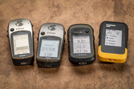 Photo for Fort Collins, CO, USA - May 29. 2023: Various models of Garmin handheld Etrex GPS device used in outdoor activities and racing over span of 20 years. - Royalty Free Image