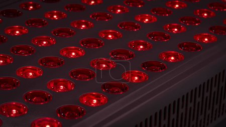 Photo for Detail of red light therapy panel  for skin health, pain relief, recovery and muscle performance and inflammation reduction - Royalty Free Image